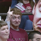 Illustration for article titled This Alabama Fan Holds A Giant, Bug-Eyed Cutout Of His Face At Games, And Were Scared